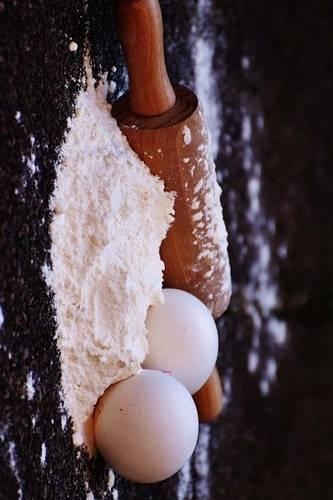 Flour Dough and a Rolling Pin Ready for Baking