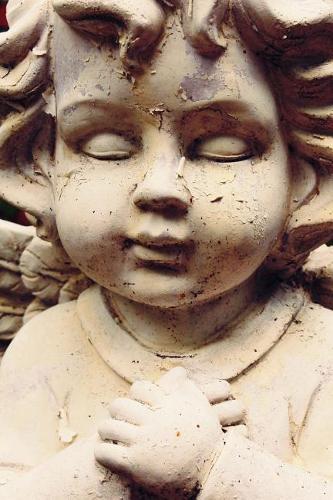 A Sweet Baby Angel Sculpture Up Close Portrait Journal