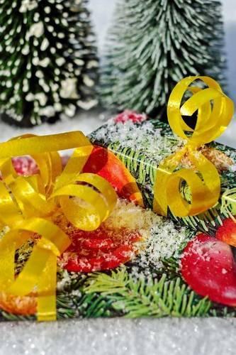 Christmas Presents in the Snow Wrapped in a Yellow Bow